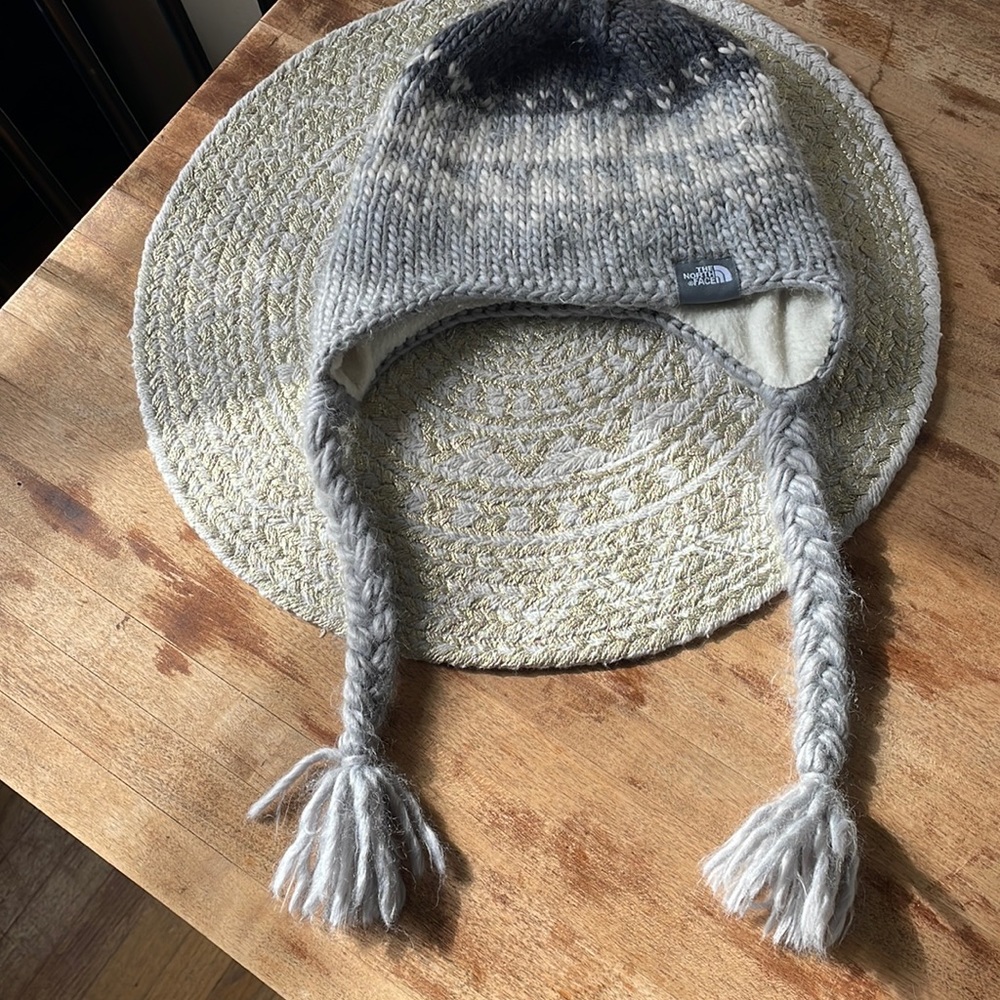 Cozy winter hat with braids.